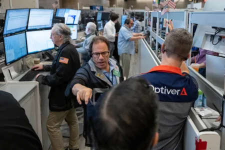 Wall Street loses ground under pressure from rising oil prices